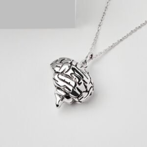 a silver necklace with a brain pendant