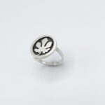 a silver ring with a leaf design