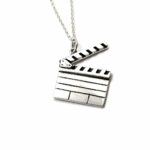 a silver necklace with a movie clapper