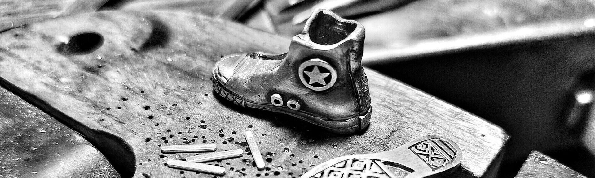 a metal shoe with a star on it