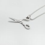 a silver scissors necklace