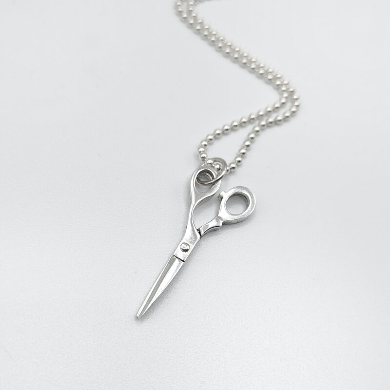 a silver scissors necklace